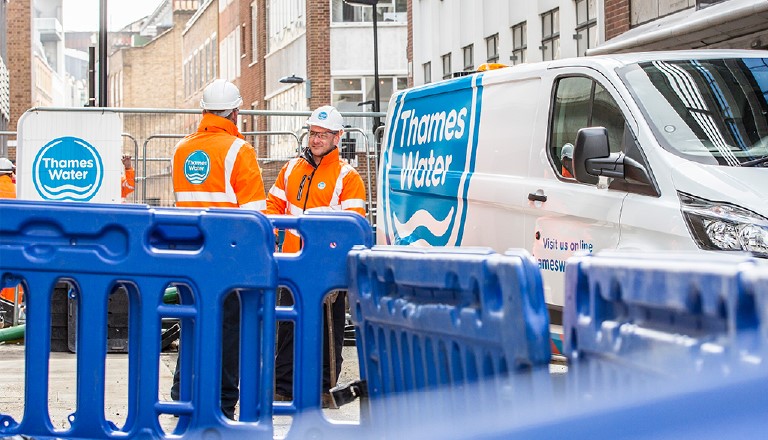 Two Thames Water staff members on site