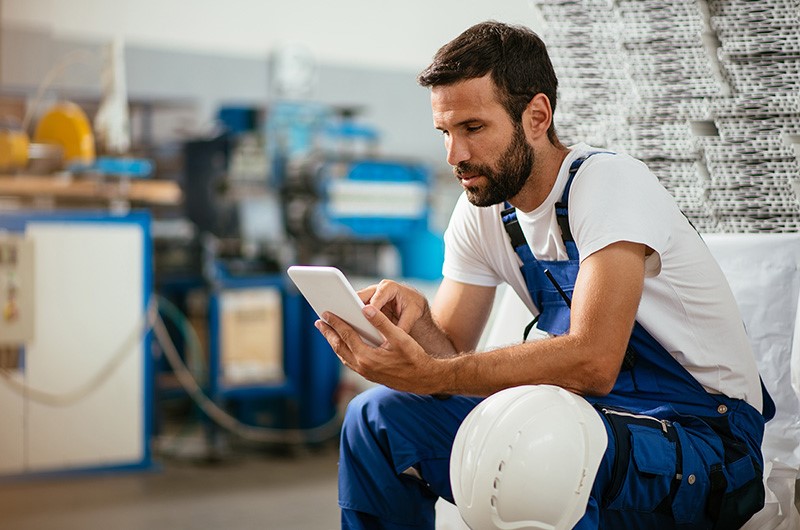 man on a chair with a tablet