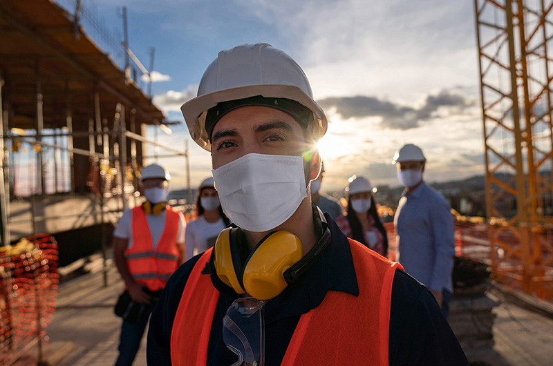 construction workers wearing masks