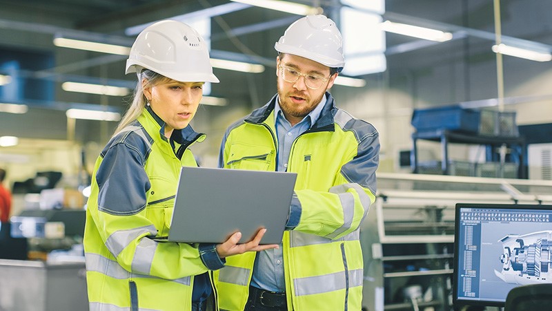 Two workers with laptop